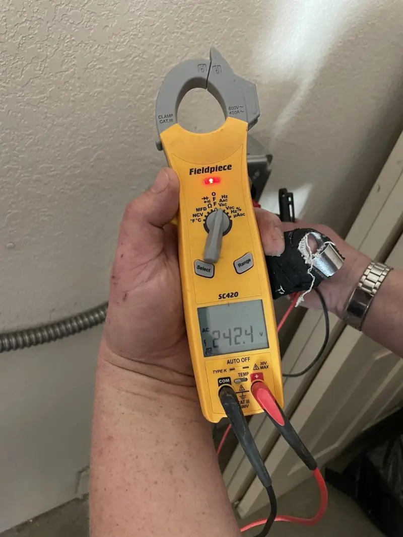 Voltage testing with clamp meter during Recessed Lighting Installation in Ketchum